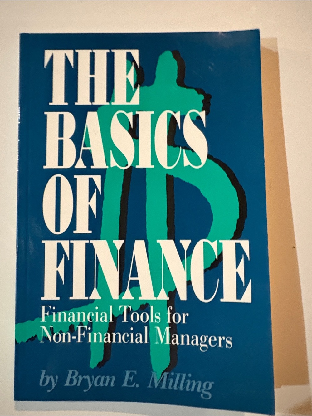 The Basics of Finance by Bryan E. Milling - Blue & Teal Cover